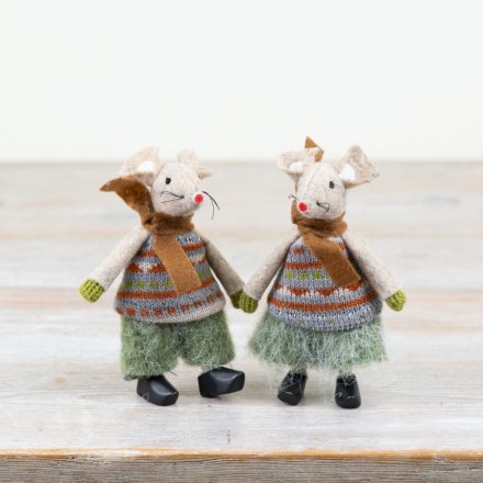Two toy mice figures wearing knitted sweaters and scarves on a wooden surface.