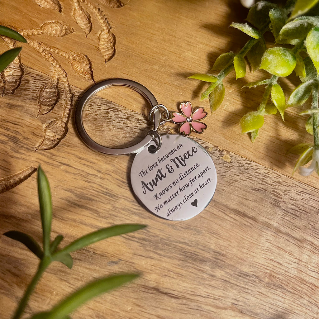 Round silver keyring with keychain and pink flower charm