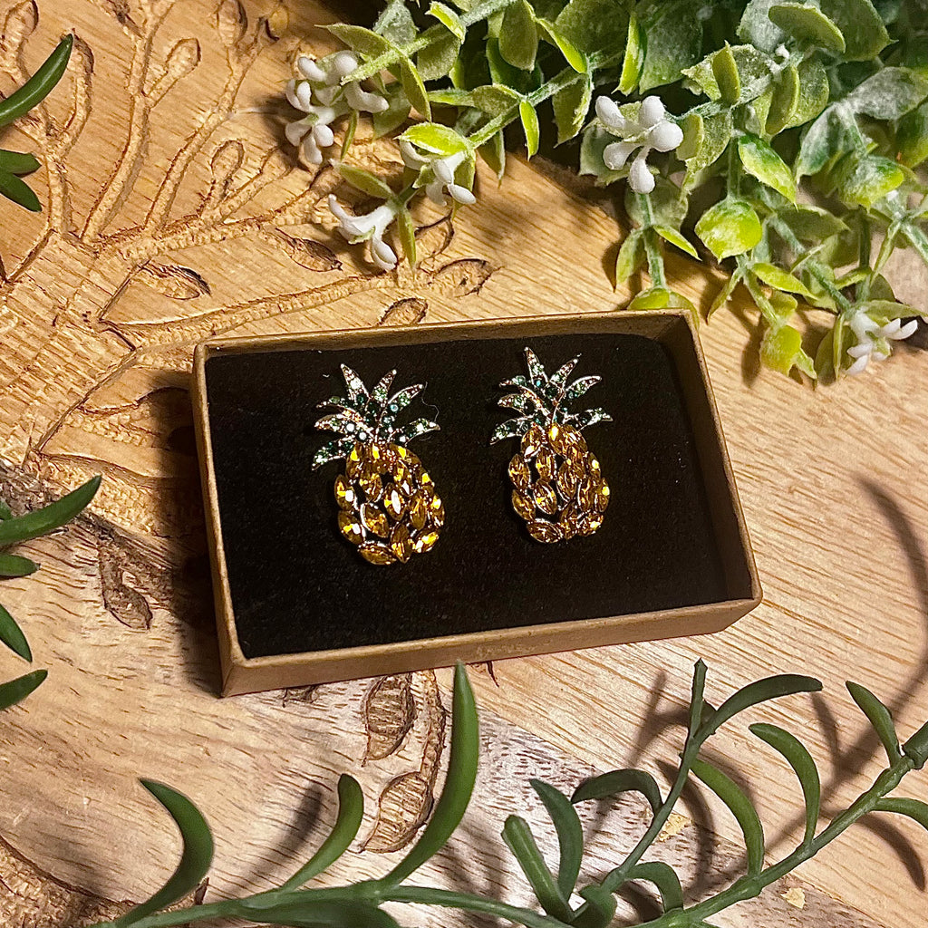 Pineapple shaped earrings with yellow almond shaped rhinestones for the body and round green rhinestones for the leaves.