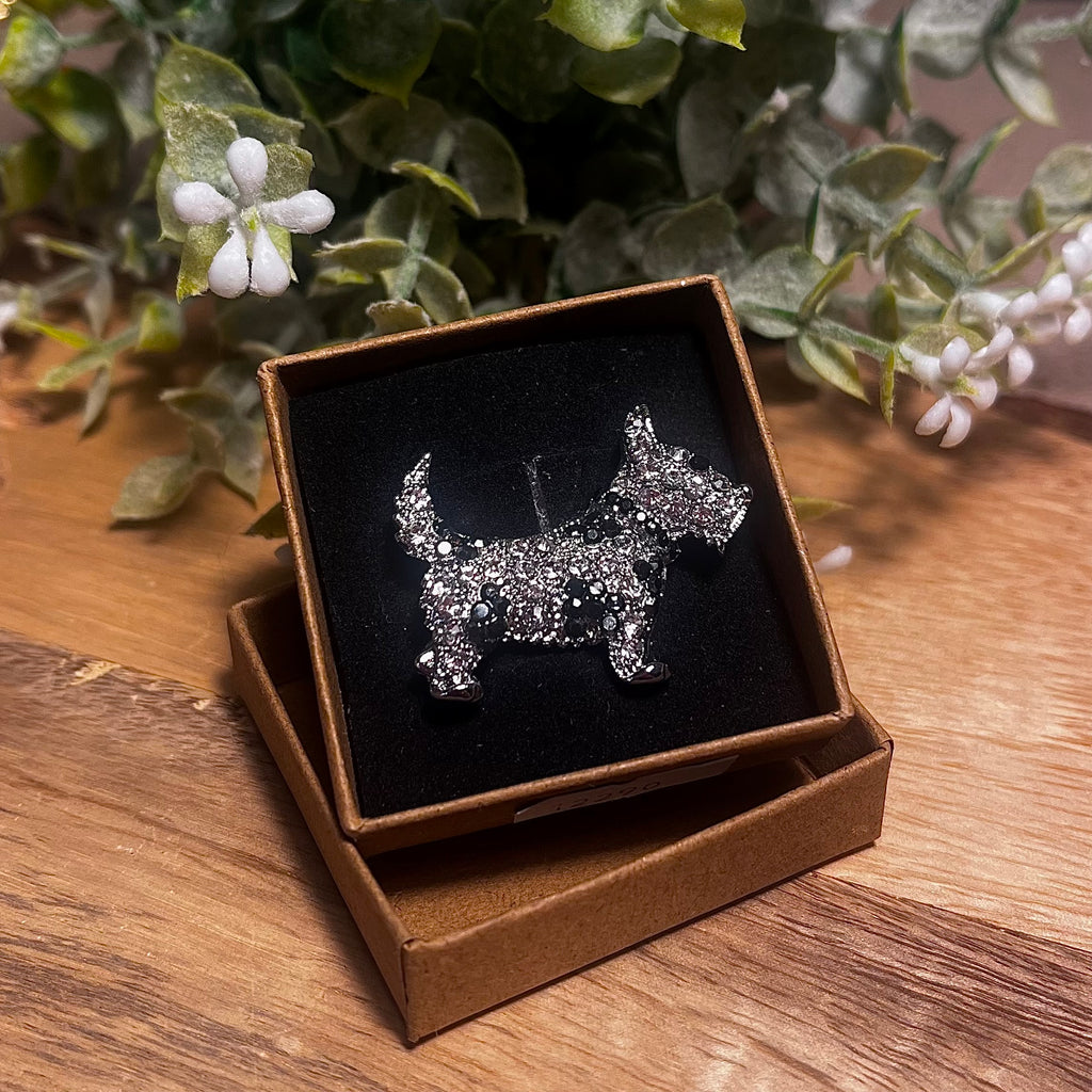 Silver rhinestone scottish terrier side facing with black crystals in patches on the fur and for the eyes. 