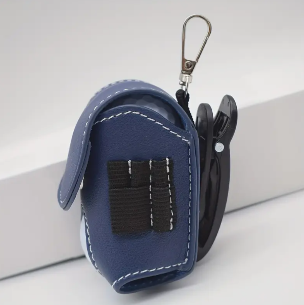 Blue keychain pouch with black clip on a white background