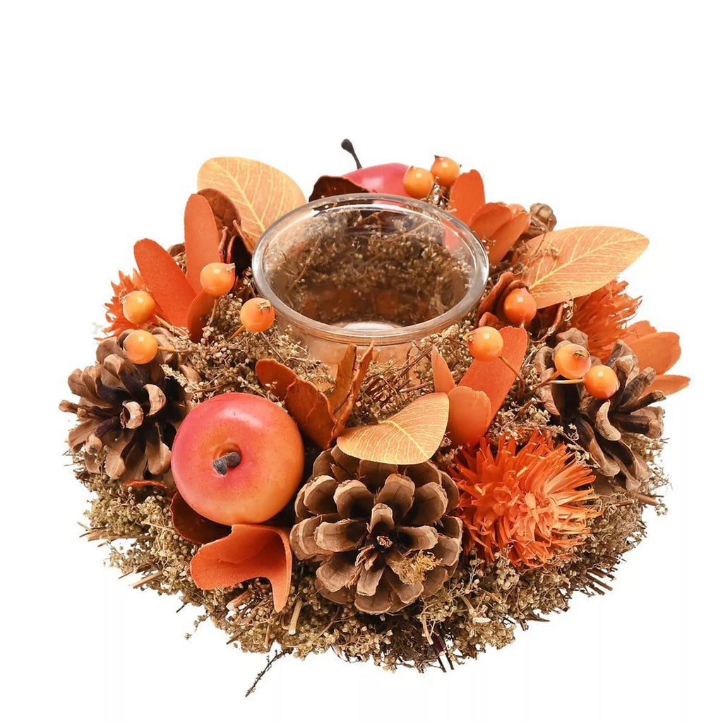 Decorative wreath with autumn elements including apples, pinecones, and leaves on a white background.