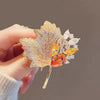 Gold-tone autumn leaf brooch with clear yellow and amber crystals